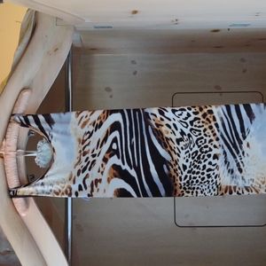 Floor length animal print dress. With straps on bac.Size Small (5/6)